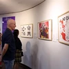 漫画展介绍43位西班牙画家的43件作品和19位越南画家的21件作品。图自越通社