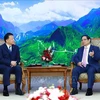 Le Premier ministre Pham Minh Chinh (droite) et Shindo Yoshitaka, ministre japonais chargé de l'Accord de partenariat transpacifique global et progressiste (CPTPP). Photo: VNA