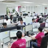 Des employés du portefeuille électronique MoMo travaillent au bureau. Photo d’illustration : VNA