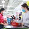 Paiement sans numéraire au supermarché Big C Thang Long. Photo : laodong.vn