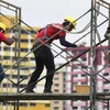 Travailleurs étrangers à Singapour. Photo : Straits Times