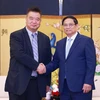 Le Premier ministre Pham Minh Chinh et un dirigeant de KIFA. Photo: VNA