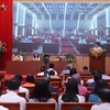 At a meeting between Hanoi's delegation of NA deputies and voters. (Photo: dbndhanoi.gov.vn)