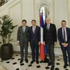 Vietnamese and French officials pose for a group photo in Paris. (Source: VNA)