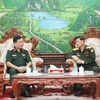 Vietnamese Deputy Minister of National Defence Sen. Lieut. Gen Hoang Xuan Chien (left) and his Lao counterpart Vongkham Phommakon at their meeting in Vientiane on October 9. (Photo: VNA)