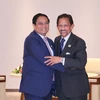 Vietnamese Prime Minister Pham Minh Chinh (left) and Sultan of Brunei Haji Hassanal Bolkiah at their meeting in Vientiane, Laos, on October 9. (Photo: VNA)