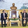 Deputy Minister of Public Security Sen. Lieut. Gen Tran Quoc To (left) and Laos Deputy Prime Minister, Minister of Public Security Gen. Vilay Lakhamphong at their meeting in Vientiane on October 9. (Photo: VNA)