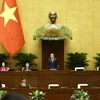 NA Chairman Tran Thanh Man (standing) and NA Vice Chairpersons at the opening ceremony of the 8th session of the 15-tenure National Assembly in Hanoi on October 21. (Photo: VNA)