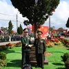 Vietnamese Minister of National Defence General Phan Van Giang (left) and Lao Deputy Prime Minister and Minister of National Defence Chansamone Chanyalath plant a tree at the exchange event. (Photo: VNA)