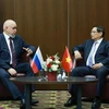 Prime Minister Pham Minh Chinh (right) and Russian Minister of Energy Sergey Tsivilev. (Photo: VNA)