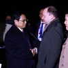 Prime Minister Pham Minh Chinh (second, left) at Kazan International Airport, concluding his trip to Russia to attend the expanded BRICS Summit. (Photo: VNA)