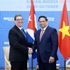 Prime Minister Pham Minh Chinh (right) and Cuban Foreign Minister Bruno Rodriguez Parrilla at their meeting on the sidelines of the expanded BRICS Summit in Kazan, Russia, on October 24. (Photo: VNA)