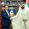 Prime Minister Pham Minh Chinh (left) and UAE Vice President and Prime Minister Sheikh Mohammed bin Rashid Al Maktoum. (Photo: VNA)