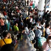 Holidaymakers wait to take buses to their hometowns during the Songkran long holiday in April this year, at Mo Chit bus terminal in Bangkok. (Photo: Bangkok Posts) 