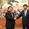 Politburo member Nguyen Xuan Thang, Chairman of the Central Theory Council and President of the Ho Chi Minh National Academy of Politics (left) and Wang Huning, member of the Standing Committee of the CPC Central Committee’s Political Bureau and Chairman of the Chinese People's Political Consultative Conference. (Photo: VNA)