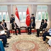 National Assembly Chairman Tran Thanh Man (left) meets with Singapore President Tharman Shanmugaratnam. (Photo: VNA)