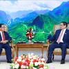越南政府总理范明政会见老挝国家监察总署署长坎潘·蓬马塔。图自越通社