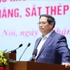 越南政府总理范明政在会上发言。图自越通社