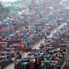 Shipping containers are stacked at a port in Busan (Photo: koreatimes.co.kr)