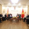 Minister of Construction Nguyen Thanh Nghi and Algeria's Minister of War Veterans and Rights Holders Laid Rebigua, Hanoi, July 26 (Photo: VNA)
