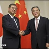 Japanese Prime Minister Shigeru Ishiba (L) and Chinese Premier Li Qiang (Photo: VNA)