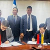 Delegates at the signing ceremony (Photo: VNA)