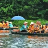 Foreign tourists visit Trang An Scenic Landscape Complex, Ninh Binh (Photo: VNA)