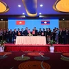 Cérémonie de signature du nouvel accord commercial Vietnam-Laos. Photo: Vietnamplus