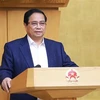 Le Premier ministre Pham Minh Chinh à la conférence gouvernementale sur le dressement du bilan de la mise en œuvre de la Résolution n° 18-NQ/TW. Photo: VNA