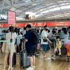 Los turistas surcoreanos hacen cola para hacer el check-in del vuelo hacia Phu Quoc, Vietnam (Fuente: VNA)