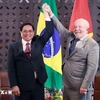 El primer ministro de Vietnam, Pham Minh Chinh y el presidente de Brasil, Luiz Inácio Lula da Silva, el 21 de mayo de 2023. (Fuente: VNA)