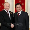 El presidente de Rusia, Vladimir Putin y el presidente de Laos, Thongloun Sisoulith, se reúnen en Moscú el 9 de mayo de 2024 (Fuente: AFP)