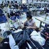 La producción de prendas de vestir en Vietnam para la exportación (Fuente: VNA)
