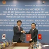 El ministro de Construcción de Vietnam, Nguyen Thanh Nghi, y el ministro de Tierra, Infraestructura y Transporte de Corea del Sur, Park Sangwoo, firman el memorando de entendimiento (Fuente: diendandoanhnghiep.vn)