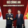 El coronel general Luong Tam Quang, ministro de Seguridad Pública de Vietnam, y el comisionado general de la Agencia Nacional de Policía de Corea del Sur, Cho Ji Ho. (Fuente: VNA)