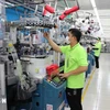 En una empresa de inversión surcoreana en Vietnam (Fuente: VNA)