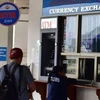 Foreign currency trade is not allowed at unauthorised establishments in Laos. (Photo: Internet of Laos)