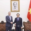 Deputy PM Tran Luu Quang (R) and Chief Operations Officer of the Denmark-based LEGO Group Carsten Rasmussen (Photo: VNA)