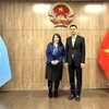 Ambassador Dang Hoang Giang (R) and Director of UNICEF’s Public Partnerships Division June Kunugi (Photo: VNA)