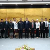 Chairman of the Da Nang People's Committee Le Trung Chinh receives a delegation from the People's Court of central Laos. (Photo: VNA)