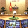Deputy PM Tran Luu Quang at the online conference (Photo: VNA)