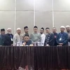 Jemaah Islamiyah's Indonesian senior leader Abu Rusdan (seated) with other members declaring on June 30 that the terror group has been dissolved. (Photo: Former JI member)