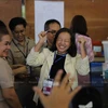 A candidate for the Senate expresses joy at a polling station in Bang Kapi district of Bangkok after hearing she passed the first round of the Senate election on June 9. (Photo: Bangkokpost)
