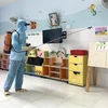 A medical worker sprays disinfectant at a preschool with children suffering from hand-foot-mouth disease in Phu Yen province. (Photo: VNA)