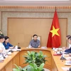 Deputy Prime Minister Tran Hong Ha on October 7 chairs a meeting on the completion of a draft project on establishing and developing a compliance carbon market in Vietnam. (Photo: VNA)