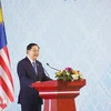 Lao Prime Minister Sonexay Siphandone speaks at the summit. (Photo: VNA)