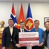 Vietnamese people in Norway have recently donated nearly 12,000 USD in support of the homeland's disaster relief efforts. (Photo: VNA)