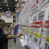 A visitor browses travel promotions at a travel fair in Nonthaburi province. (Photo: Bangkok Post)