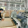 Inside a wood processing firm at Tan Binh Industrial Park in Binh Duong province. (Photo: baobinhduong.vn)