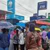 Residents of Phimai district in Nakhon Ratchasima queue to withdraw handout cash from ATMs in September. (Photo: Bangkok Post)